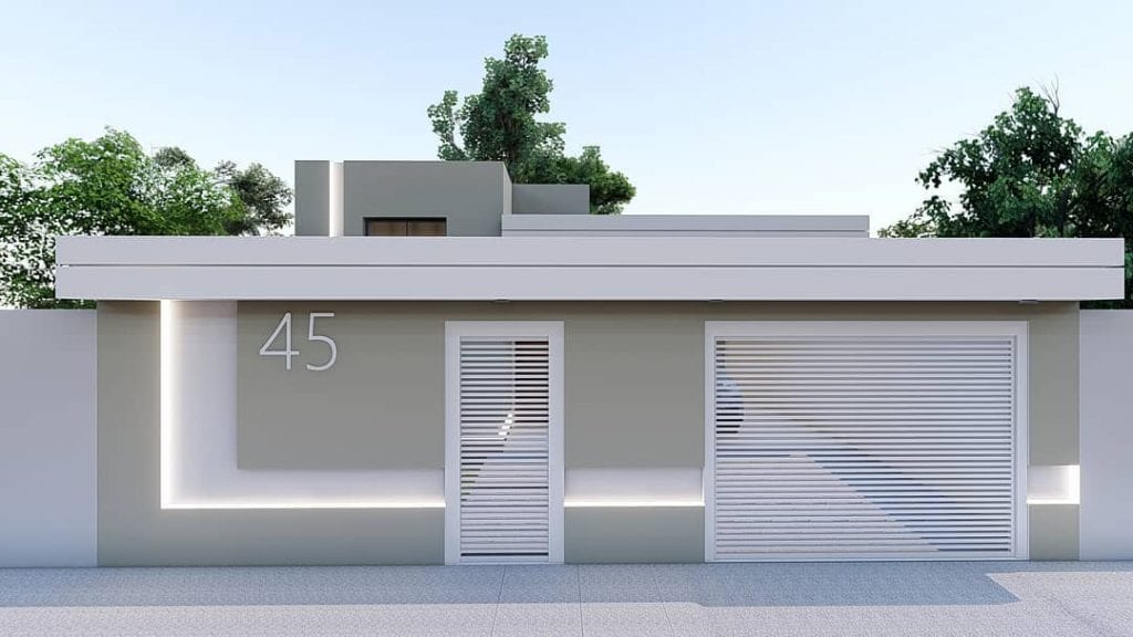 fachadas de casas com muro e portão de pedra
